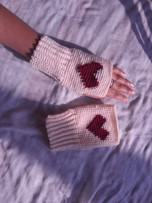 off white hand warmers with pixelated red heart