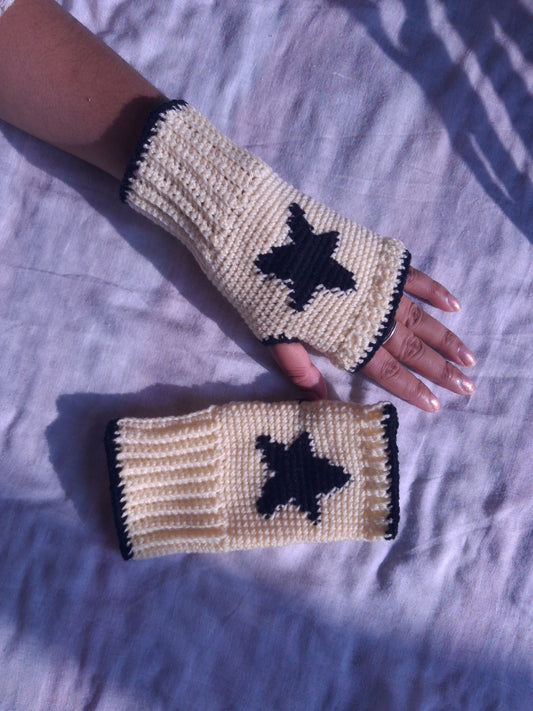 cream hand warmers with black star