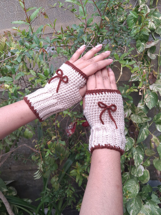 Beige hand warmers with brown bow